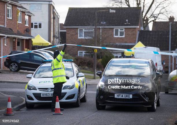 Police officers search the home of Sergei Skripal in Salisbury who was found critically ill on a bench with his daughter on March 4 and were taken to...