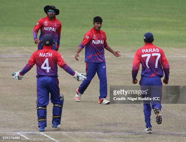Sandeep Lamichhane of Nepal celebrates taking the wicket of Richie Berrington of Scotland during the ICC Cricket World Cup Qualifier between Scotland...