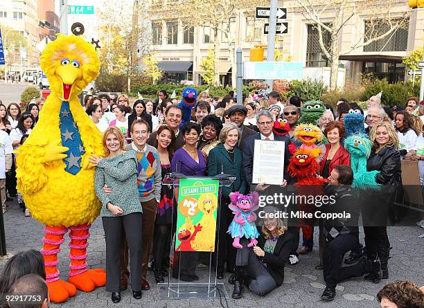 Sesame Street founder and TV producer Joan Ganz Cooney holds the New York City proclamation "Sesame Street Day" along with the cast and crew of...