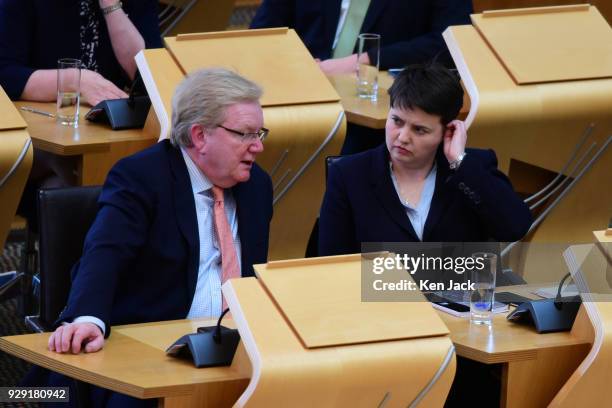 Scottish Conservative leader Ruth Davidson confers with her deputy Jackson Carlaw at First Minister's Questions in the Scottish Parliament, on March...