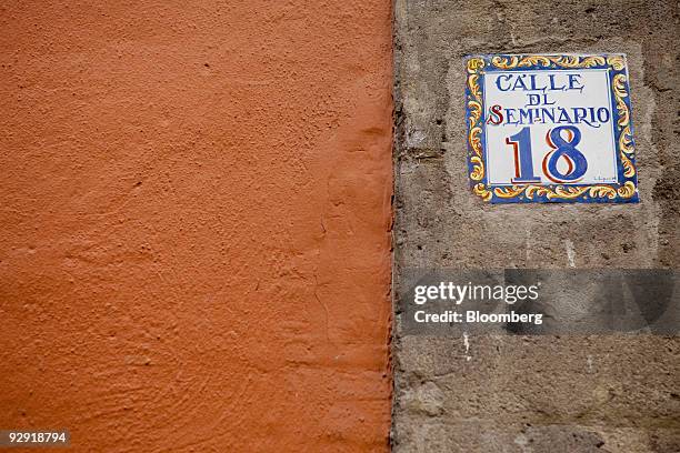 Sign sits on a building along Seminario Street in Mexico City, Mexico, on Friday, Nov. 6, 2009. Mexico's economy will grow 3.1 percent in 2010, after...