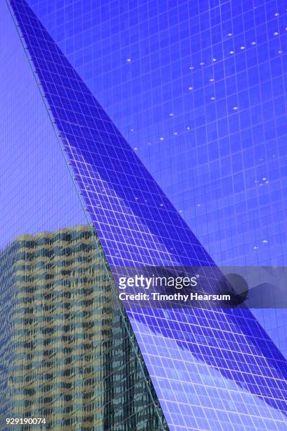 detail view of city skyscraper with reflection of a nearby building - timothy hearsum stock pictures, royalty-free photos & images