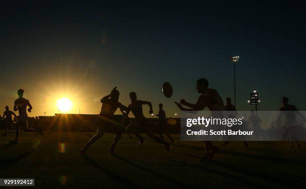 General view of play as the sun sets during the JLT Community Series AFL match between the Melbourne Demons and the St Kilda Saints at Casey Fields...