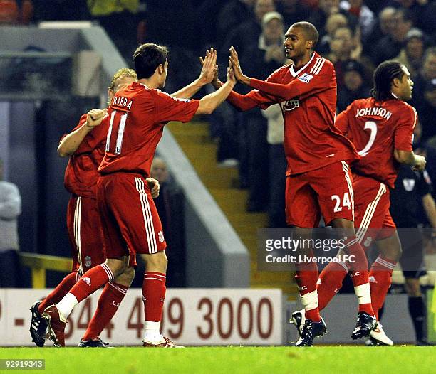David Ngog of Liverpool celebrates with team mate Albert Riera after scoring a goal during the Barclays Premier League match between LiverpooL FC and...