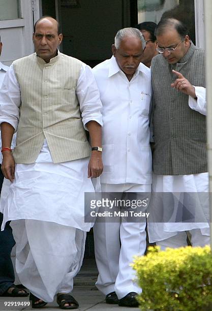President Rajnath Singh, senior BJP leder Arun Jaitley and Karnataka Chief Minister B S Yeddyurappa after a meeting at Singh's residence in New Delhi...