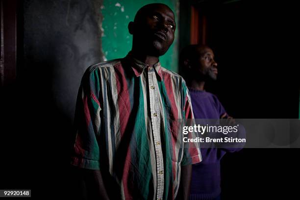 Moses Muhimuka,40 and Amona Sebogogo convicted of the gorilla slayings of July 2007, photographed at Goma Central prison on March 27, 2007. These two...