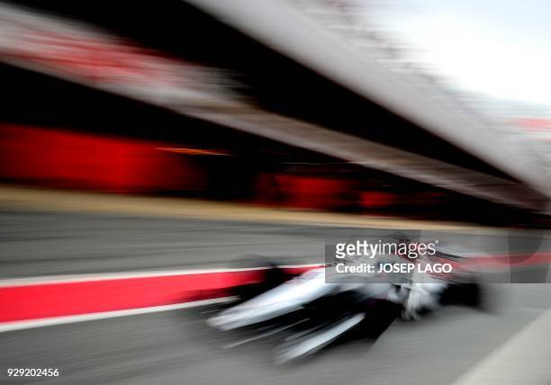 Sauber F1 Team's Swedish driver Marcus Ericsson enters the pits at the Circuit de Catalunya on March 8, 2018 in Montmelo on the outskirts of...