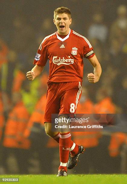 Steven Gerrard of Liverpool celebrates scoring his team's second goal from the penalty spot during the Barclays Premier League match between...