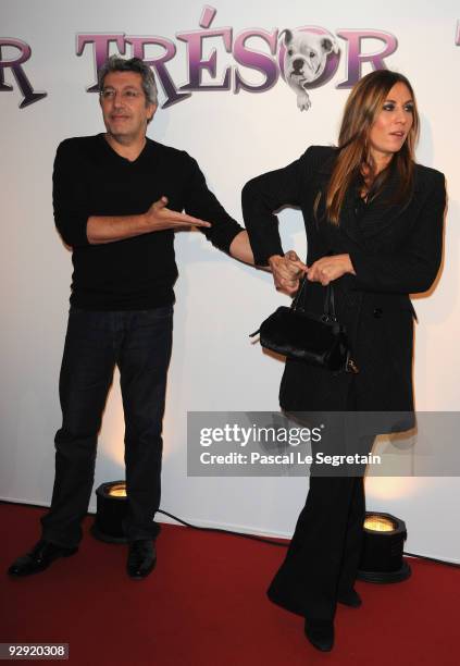 Actors Alain Chabat and Mathilde Seigner pose as they attend the premiere of the directors Claude Berry and Francois Dupeyron's film "Tresor" at...