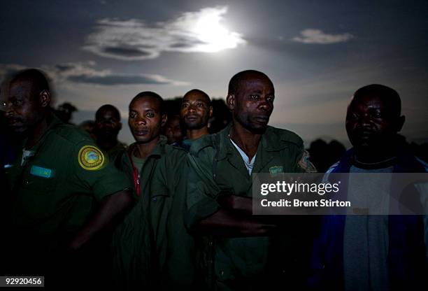 Scenes of the camp site and tired Rangers at midnight at the Kibati ICCN Rangers station. ICCN Advance Force rangers at the Kibati Station are...