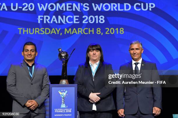 Mexico Coach Mario Dominguez, England Head Coach Mo Marley and Brazil Head Coach Dorival Bueno pose with the Trophy during the official draw for the...