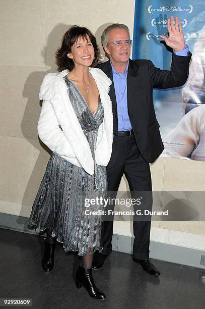 Actors Sophie Marceau and her companion Christopher Lambert attend the premiere of "L'Homme de chevet" at Cinematheque Francaise on November 9, 2009...