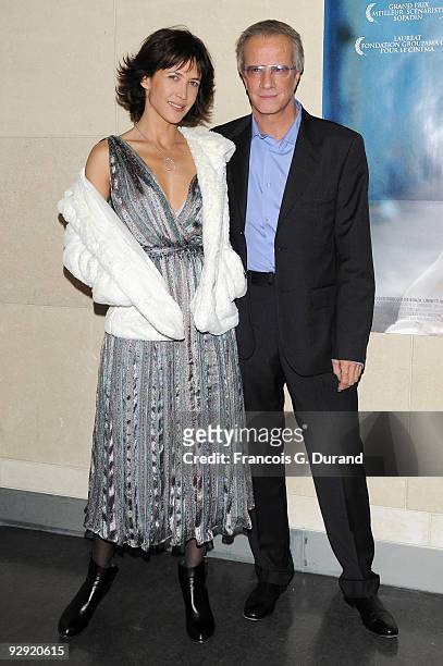 Actors Sophie Marceau and her companion Christopher Lambert attend the premiere of "L'Homme de chevet" at Cinematheque Francaise on November 9, 2009...