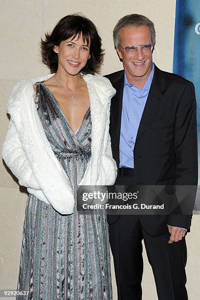 Actors Sophie Marceau and her companion Christopher Lambert attend the premiere of "L'Homme de chevet" at Cinematheque Francaise on November 9, 2009...