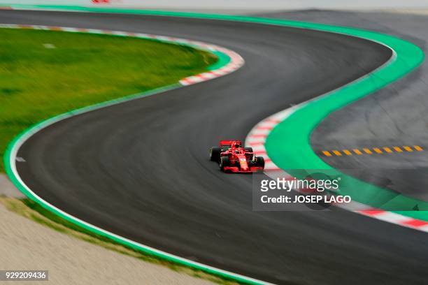 Ferrari's German driver Sebastian Vettel drives at the Circuit de Catalunya on March 8, 2018 in Montmelo on the outskirts of Barcelona during the...