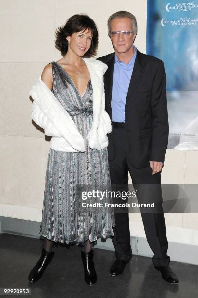 Actors Sophie Marceau and her companion Christopher Lambert attend the premiere of "L'Homme de chevet" at Cinematheque Francaise on November 9, 2009...