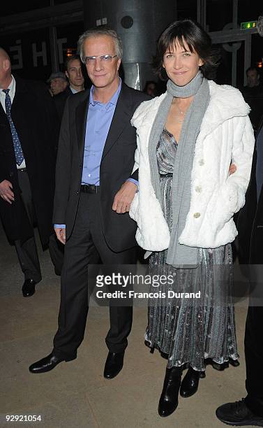 Actors Christopher Lambert and his companion Sophie Marceau attend the premiere of "L'Homme de chevet" at Cinematheque Francaise on November 9, 2009...