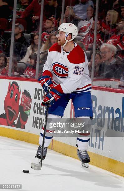 Karl Alzner of the Montreal Canadiens plays the puck against the New Jersey Devils at Prudential Center on March 6, 2018 in Newark, New Jersey.