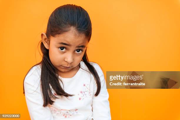 little girl facial expressions - guilt stock pictures, royalty-free photos & images