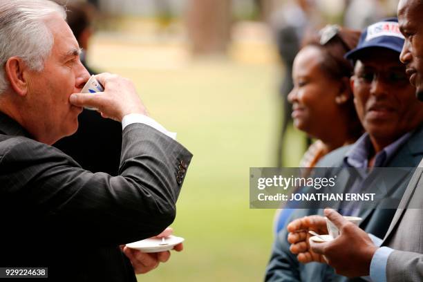 Secretary of State Rex Tillerson drinks a cup of brewed coffee during a traditional coffee ceremony at the U.S. Embassy in Addis Ababa on March 8,...