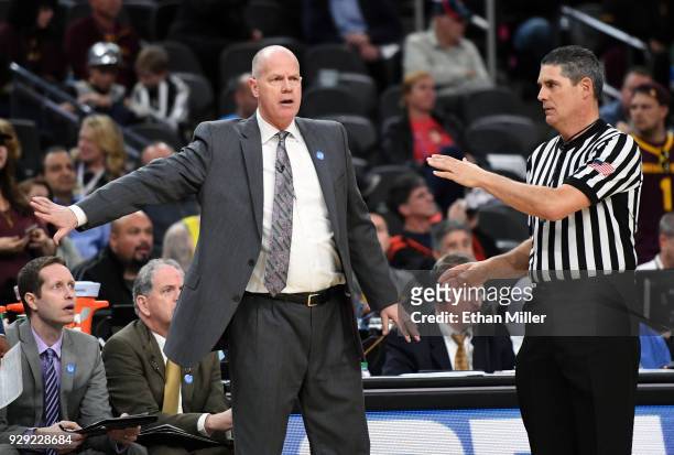 Head coach Tad Boyle of the Colorado Buffaloes signals his players during a first-round game of the Pac-12 basketball tournament against the Arizona...