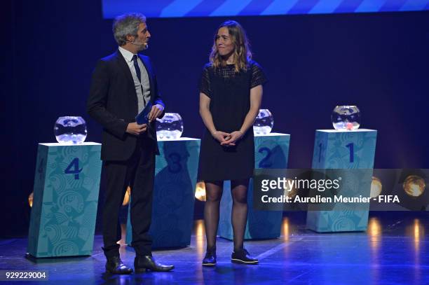 Romain Balland presents Camille Abily as he arrives for the official draw for the FIFA U-20 Women's World Cup France 2018 on March 8, 2018 in Rennes,...