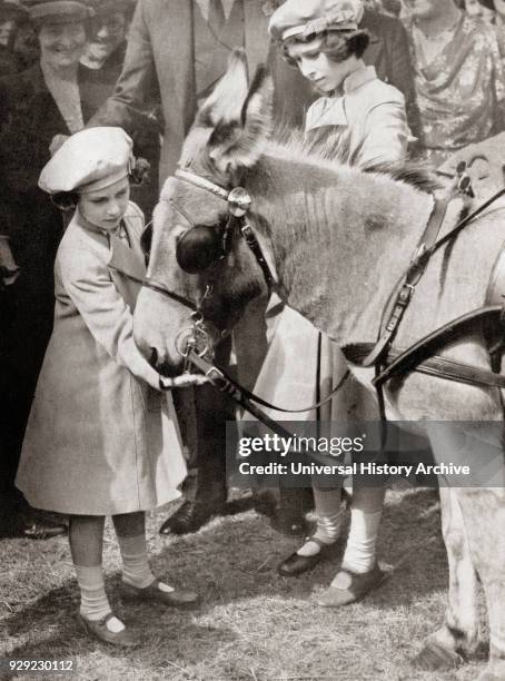 Princess Margaret, left, and Princess Elizabeth, future Queen Elizabeth II, right, at the Royal Agricultural Show in 1939. Princess Margaret,...