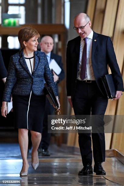 First Minister of Scotland Nicola Sturgeon and deputy First Minister John Swinney arrive for first minister's questions in the Scottish Parliament on...