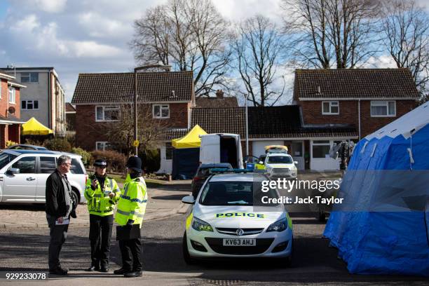 Police officers search the home of Sergei Skripal in Salisbury who was found critically ill on a bench with his daughter on March 4 and were taken to...