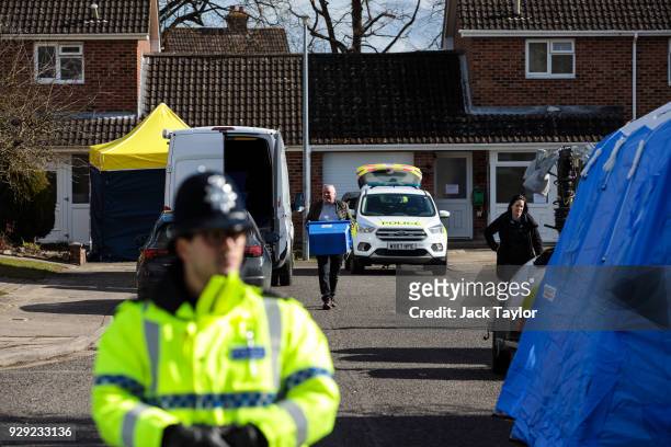 Police officers search the home of Sergei Skripal in Salisbury who was found critically ill on a bench with his daughter on March 4 and were taken to...