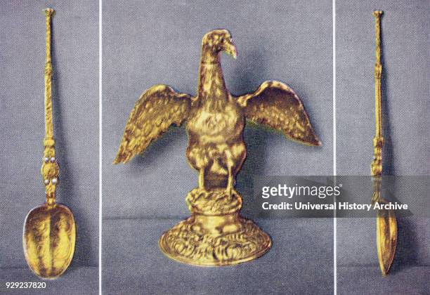 The Ampulla and two views of the Anointing Spoon. Gold, eagle-shaped vessel from which the anointing oil is poured by the Archbishop of Canterbury at...