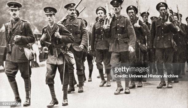The Prince of Wales leading his company of Grenadier Guards on a route march in full service kit during WWI. From The Pageant of the Century,...