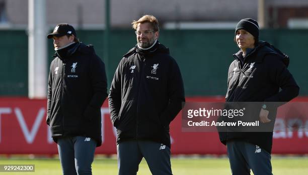 Jurgen Klopp manager of Liverpool with Zeljko Buvac First assistant coach and Peter Krawietz Second assistant coach during a training session at...