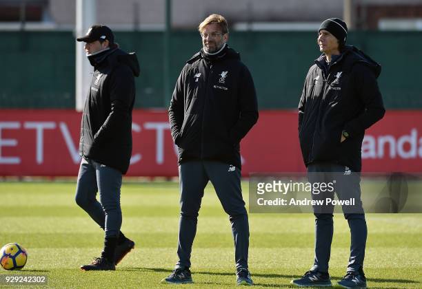 Jurgen Klopp manager of Liverpool with Zeljko Buvac First assistant coach and Peter Krawietz Second assistant coach during a training session at...