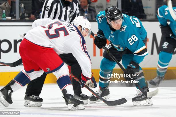 Timo Meier of the San Jose Sharks and Mark Letestu of the Columbus Blue Jackets faceoff at SAP Center on March 4, 2018 in San Jose, California.