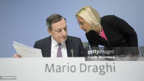 Christine Graeff, director general for communications at the European Central Bank , right, speaks to Mario Draghi, president of the European Central...