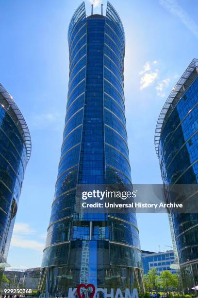 Photograph of the Warsaw Spire is a complex of Neomodern office buildings in Warsaw, Poland constructed by the Belgian real estate developer...