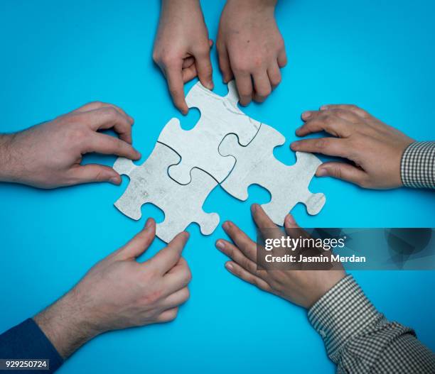 people with puzzle connecting - connect the dots child stock pictures, royalty-free photos & images