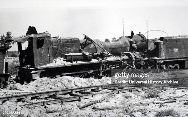 Photograph showing the wreckage of a train at Trappes, in the south-western suburbs of Paris, during the liberation of France from German occupation...