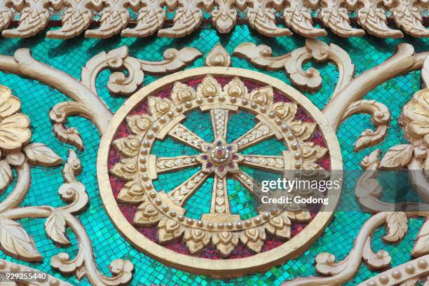 Dharma wheel. Wat Inpeng. Ventiane, Laos.