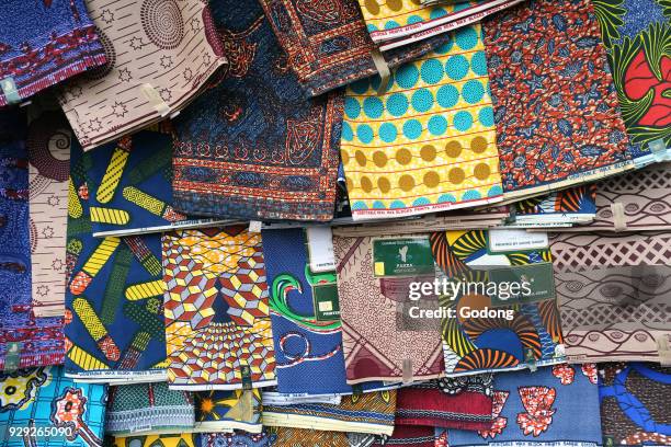 African market. Hanging wax print cloths. Togo.