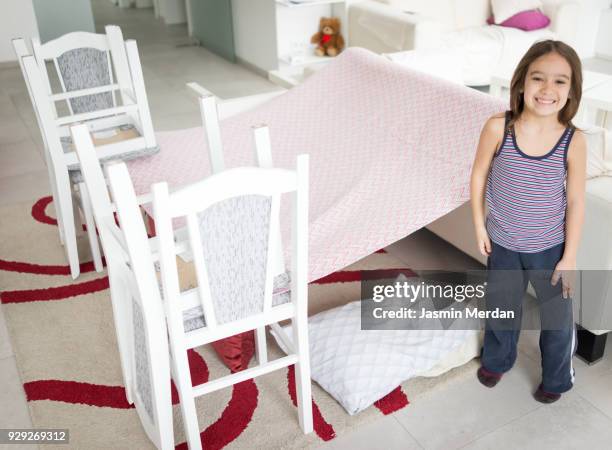 child building with pillows and chairs - kids fort stock pictures, royalty-free photos & images