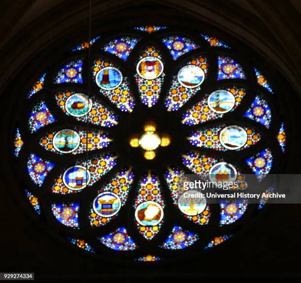 Stained glass Rose Window inside the St. Pierre Cathedral, in Geneva, Switzerland. The Cathedral belongs to the Reformed Protestant Church of Geneva....