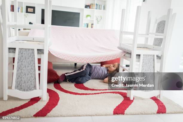 child building with pillows and chairs - kids fort stock pictures, royalty-free photos & images