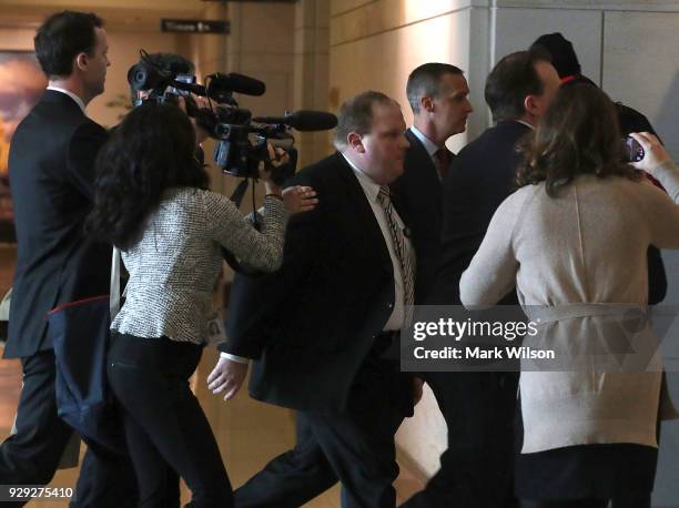 Former Trump campaign manager Corey Lewandowski is surrounded by members of the media as he arrives to appear before the House Permanent Select...