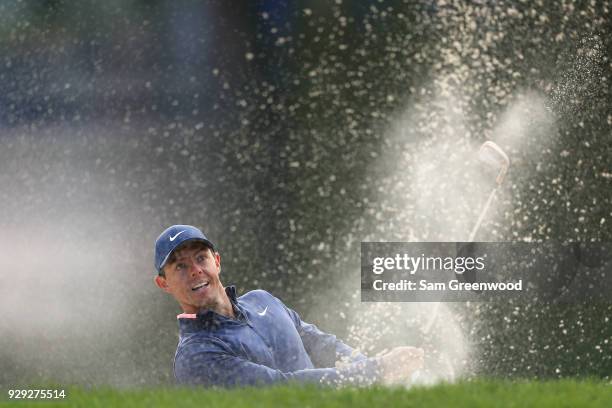 Rory McIlroy of Northern Ireland plays a shot from a bunker on the 12th hole during the first round of the Valspar Championship at Innisbrook Resort...