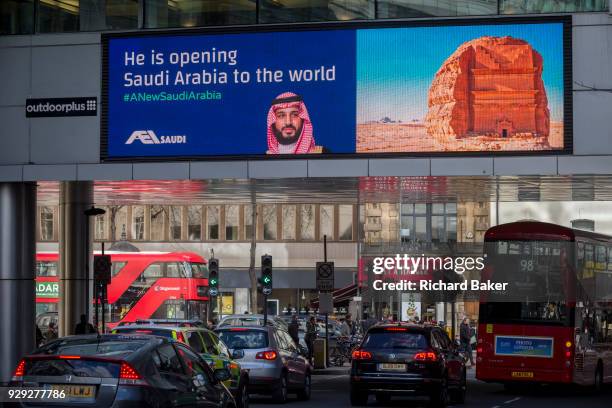 On the first day of his official 3-day visit to London, the face of Saudi Crown Prince Mohammed bin Salman appears on a large billboard at the...