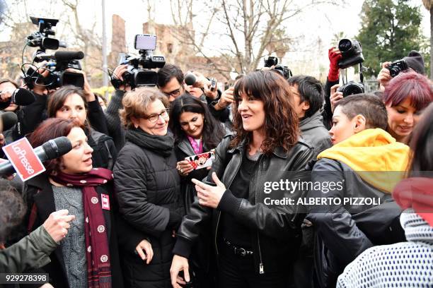 Italian actress Asia Argento and US singer and actress Rose McGowan , who both accuse Harvey Weinstein of sexual assault, take part in a march...