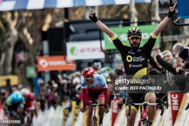 Direct Energie team French rider Jerome Cousin celebrates as he crosses the finish line to win the fifth stage of the Paris - Nice cycling race...