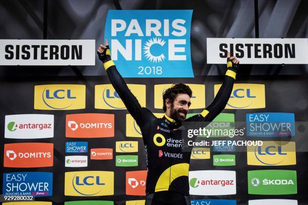 Direct Energie team French rider Jerome Cousin celebrates on the podium after he won the fifth stage of the Paris - Nice cycling race between Salon...